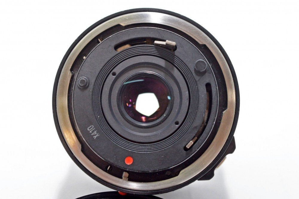 Canon 28mm f/2.8 FD lens with front and rear caps included