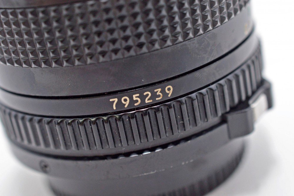 Renewed Canon 28mm f/2.8 FD lens condition label indicating restoration