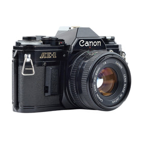 Canon AE-1 50mm lens—bright prime ideal for sharp portraits.