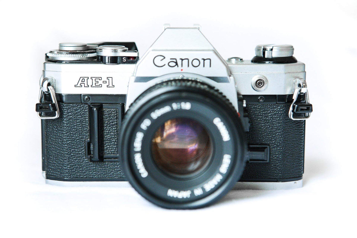 Canon AE-1 front view with durable metal body for enduring photography.