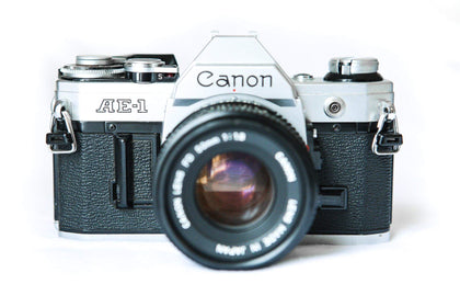 Canon AE-1 front view with durable metal body for enduring photography.