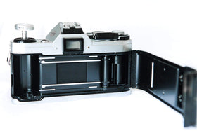 Canon AE-1 metal body texture detail for a retro aesthetic.