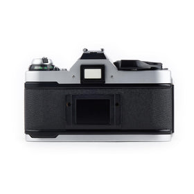 Canon AE-1 Program 50mm lens close-up emphasizes classic focal length for portraits.