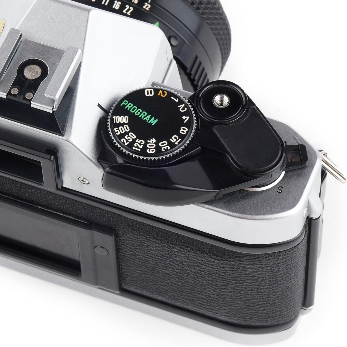 Canon AE-1 Program manual film advance lever conveys hands-on control.