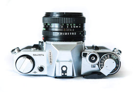 Canon AE-1 TTL metering close-up enabling accurate exposure readings.