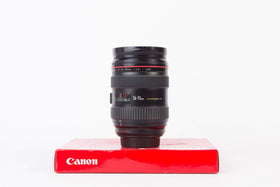 Canon EF 24-70mm f/2.8L USM lens with soft case and caps