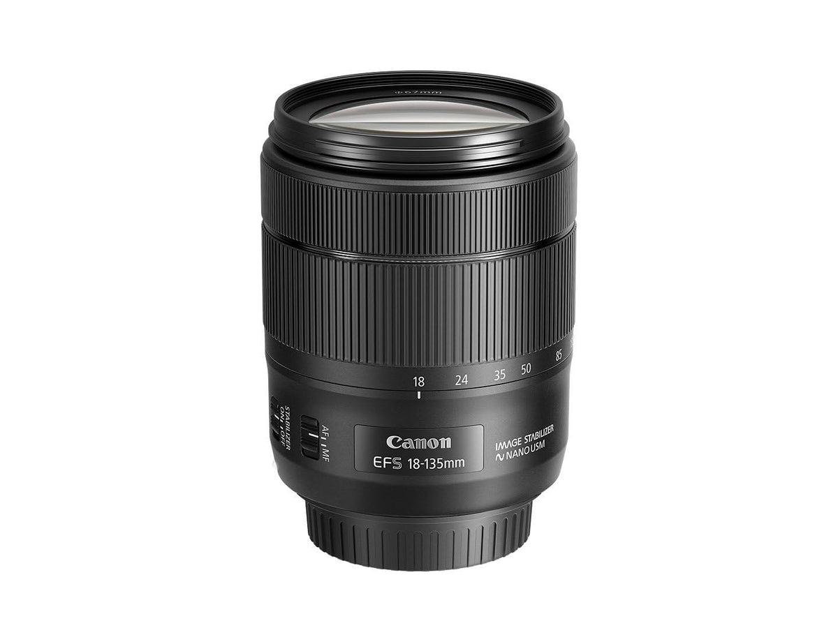 Canon EF-S 18-135mm lens mounted on a camera for versatile landscapes and portraits.