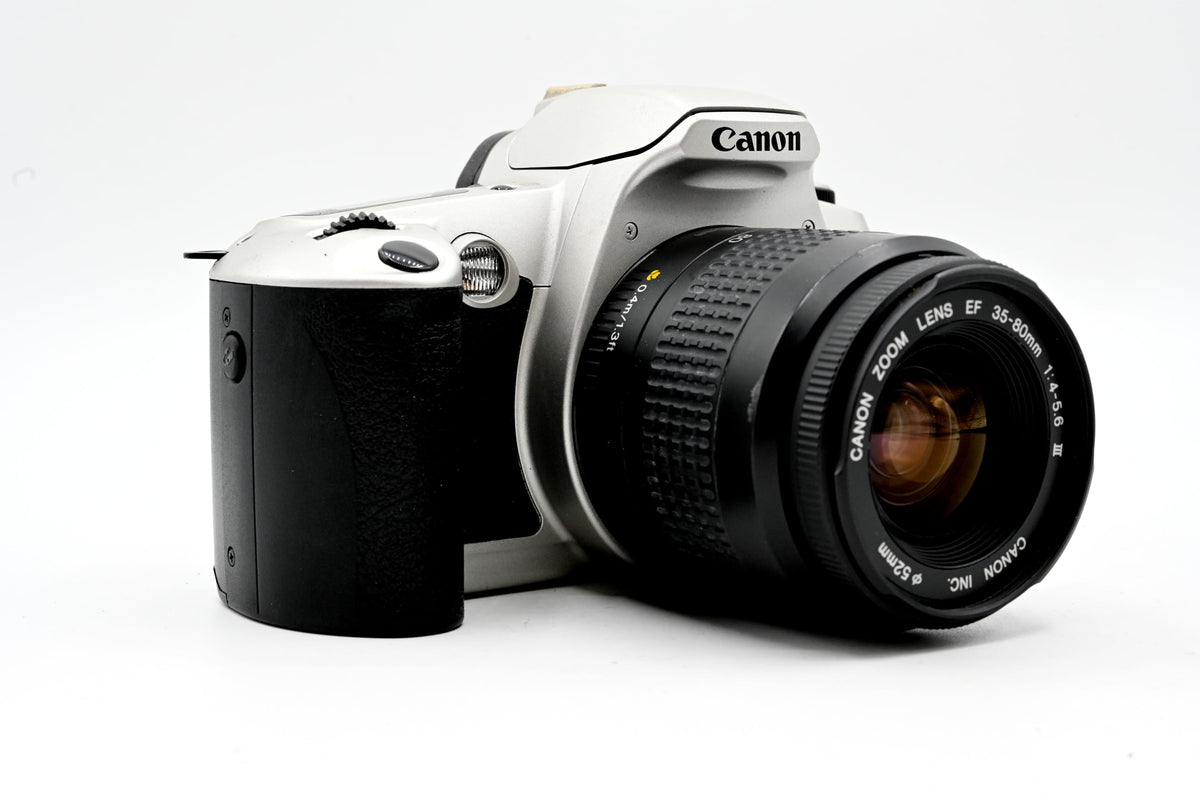 Canon EOS Kiss with 35-80mm lens attached for versatile shots.