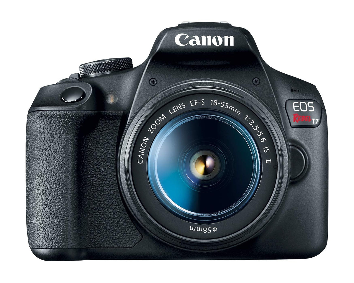 Canon EOS Rebel T7 in hand with lens ready for travel photography.