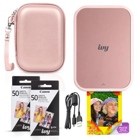 Canon Ivy 2 mini printer in blush pink on a desk printing borderless photos