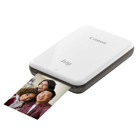 Canon IVY Mini peel-and-stick prints closeup with adhesive backs