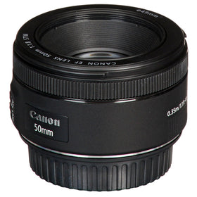 Canon lens cap keeper prevents cap loss during shoots.