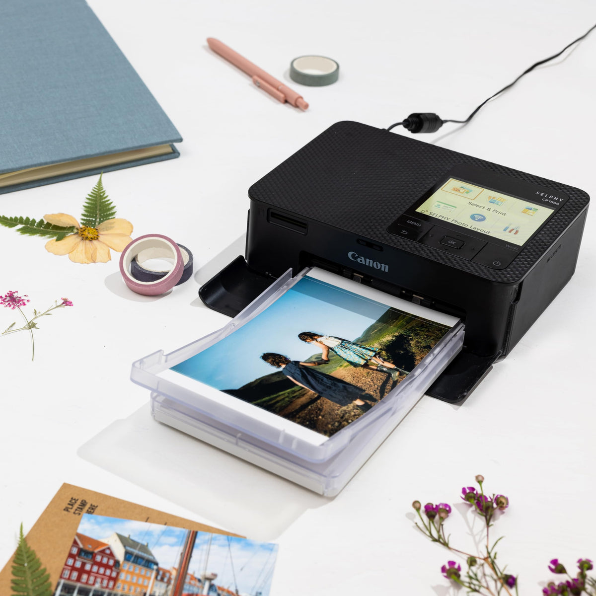 Canon Selphy CP1500 3.5-inch display for previewing edits before printing.