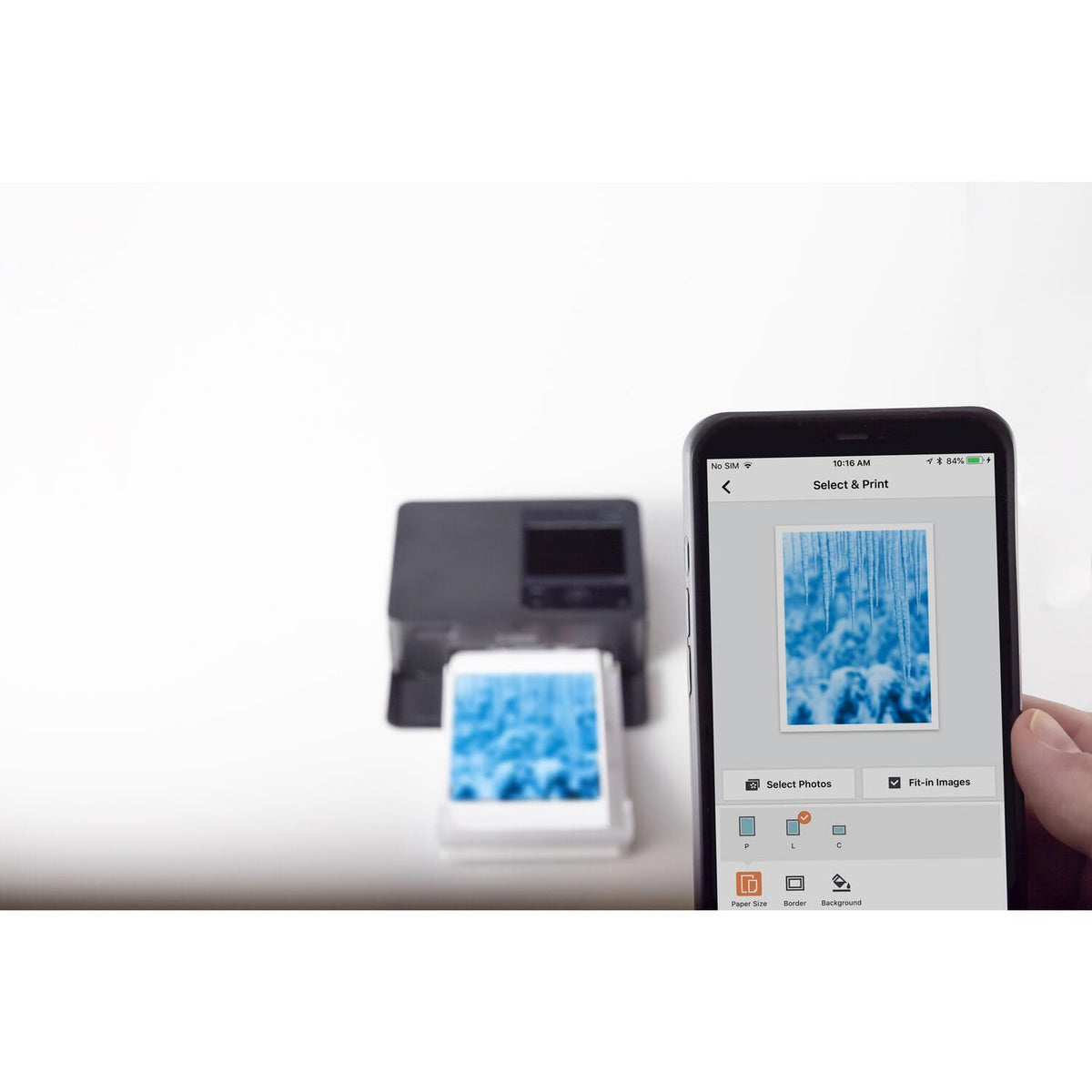 Bundled packaging shows ink, paper, and accessories for immediate use