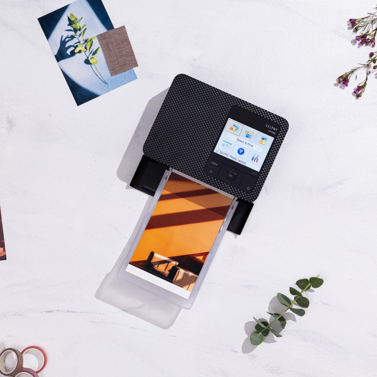 Canon Selphy CP1500 printing 4x6 photos with quick-dry results.