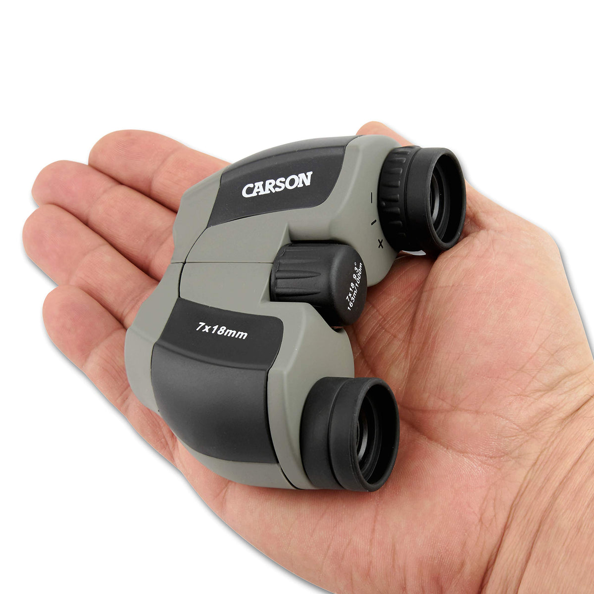 Carson MiniScout held in hand to show scale and pocketable portability benefit
