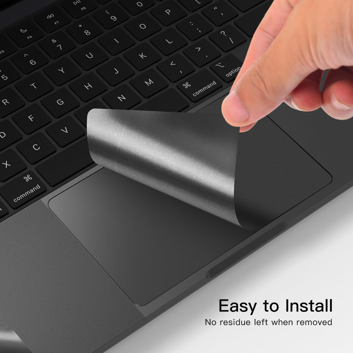 CaseBuy hands applying palm rest skin with squeegee to remove air bubbles easily