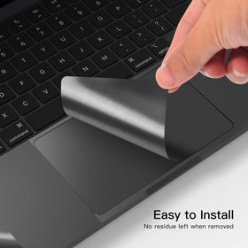 CaseBuy hands applying palm rest skin with squeegee to remove air bubbles easily