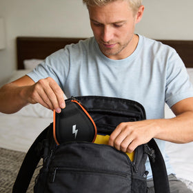 casmilee lifestyle shot runner carrying case on hip while jogging