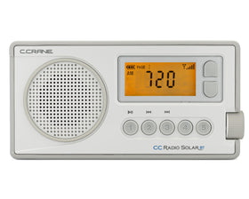 C.Crane CCRadio Solar camping setup on a table during outage or trip.