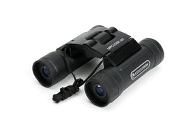 Celestron binoculars held at a stadium illustrating stable, clear viewing