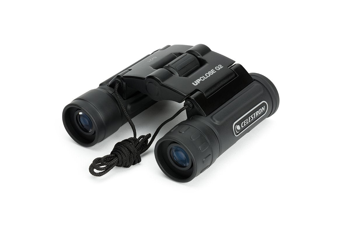 Celestron UpClose G2 8x21 binoculars, side view; rugged rubber armor for field use.