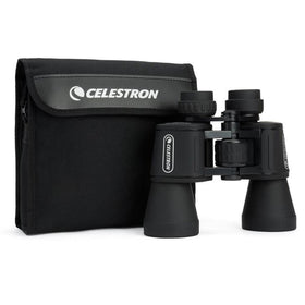 Celestron held in hand to show scale and lightweight portability advantage