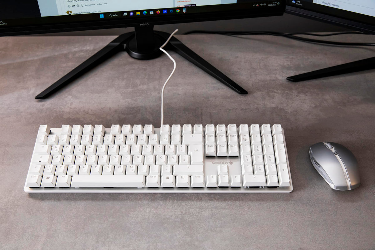 Cherry KC 200 MX side profile highlighting thin anodized metal plate and rigid slim construction benefit