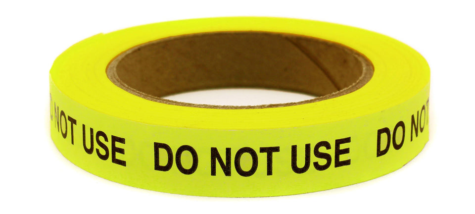 ChromaLabel front roll showing neon yellow tape and black imprint for instant visibility
