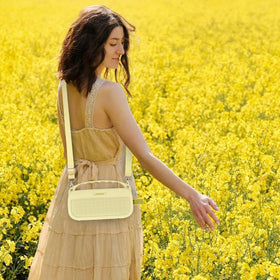 co2CREA Citrus Yellow case attached to a backpack for quick access
