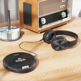 Coby player connected to USB power for uninterrupted playback benefit