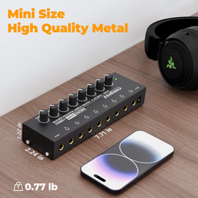 COKYISS beside a pair of headphones to show compact size and plug-and-play convenience