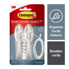 Command cord bundlers behind TV setup reduce clutter.