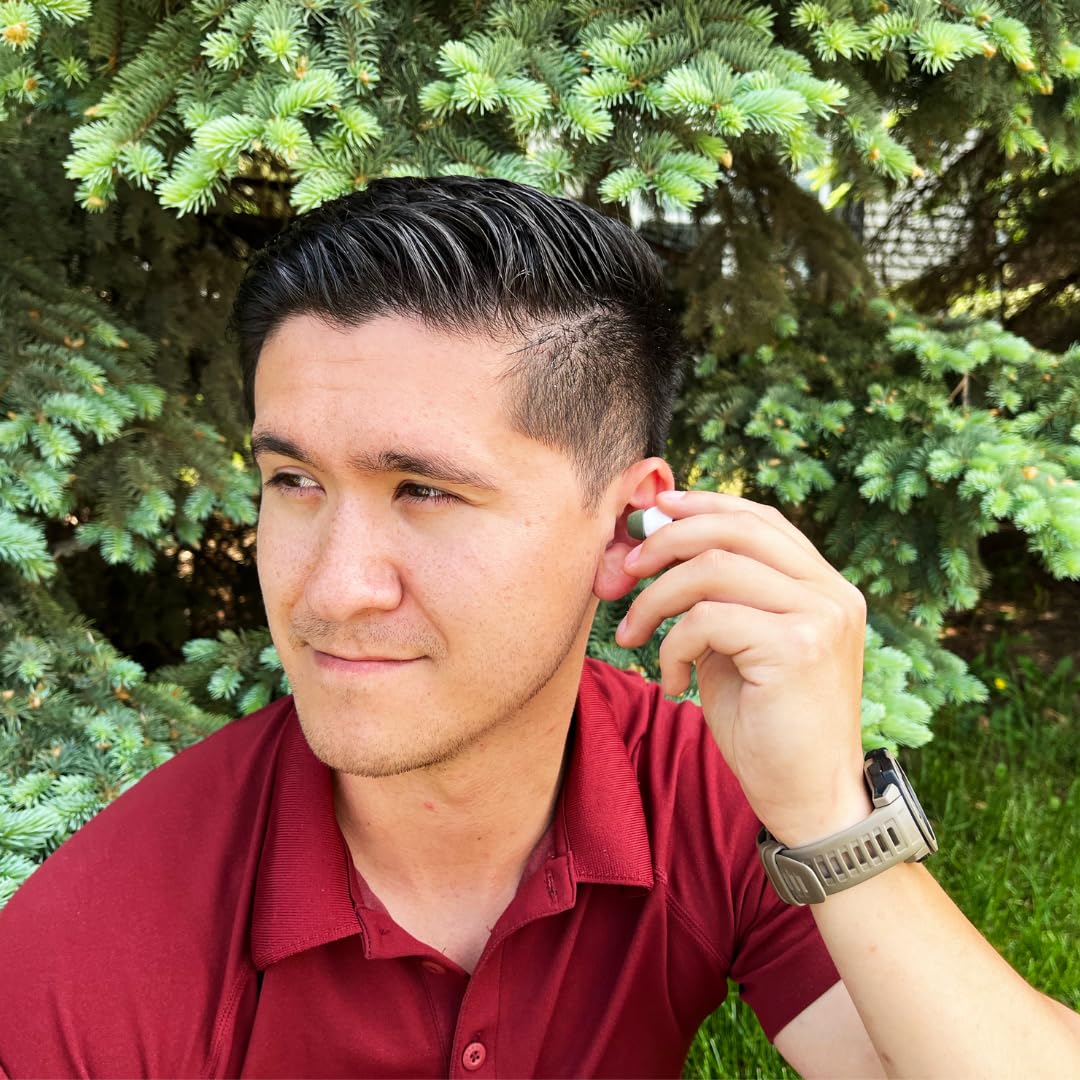 COMPLY runner wearing AirPods with tips demonstrating sweat resistance