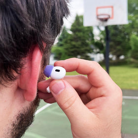 COMPLY tip with water droplets demonstrating sweat and water resistance benefit