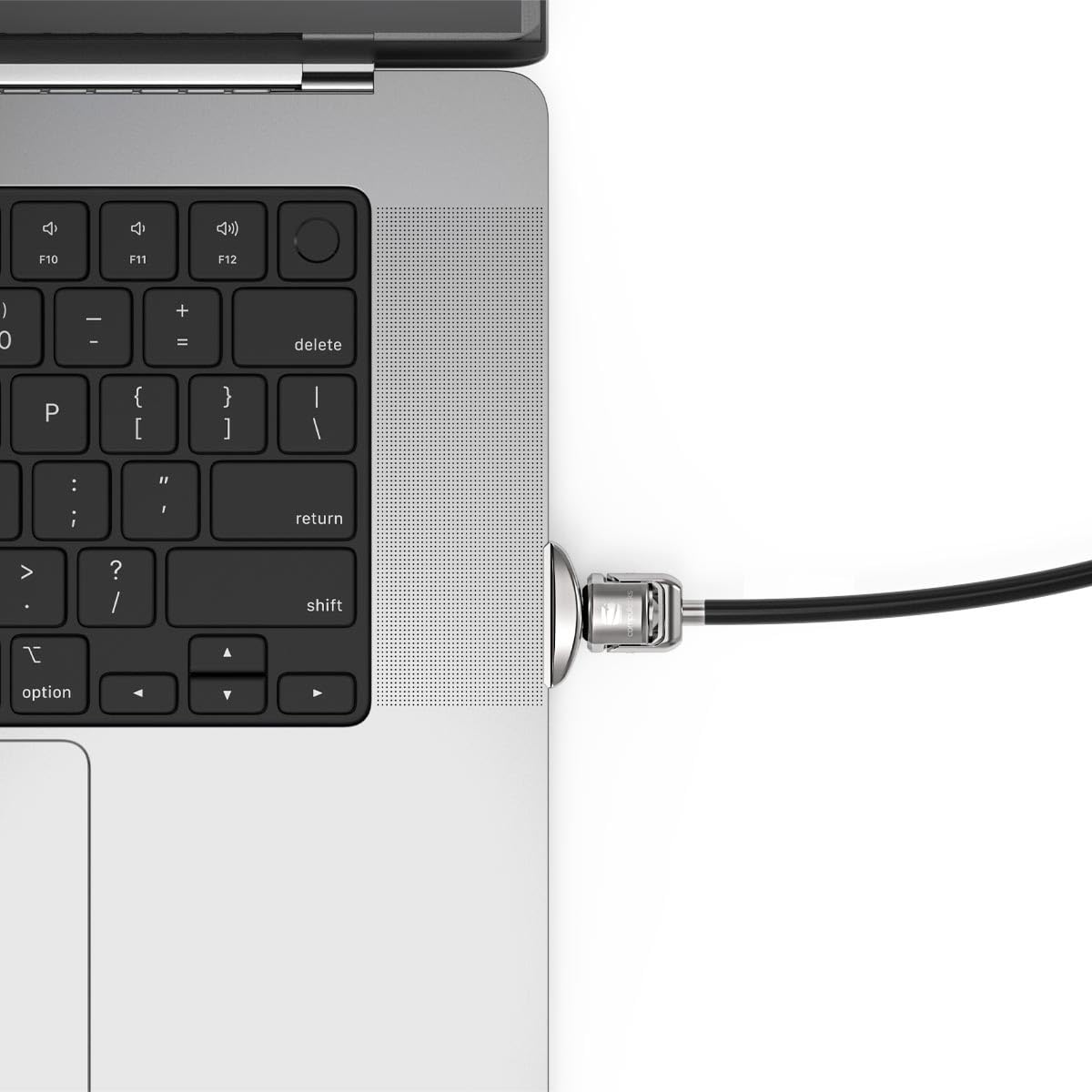 Compulocks adapter mounted beside MacBook trackpad showing secure use