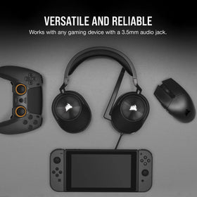 Corsair HS55 included Y-adapter beside headset showing PC compatibility benefit