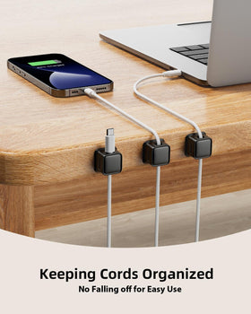 Costop adhesive cord holder on nightstand reduces clutter and provides easy access to cables