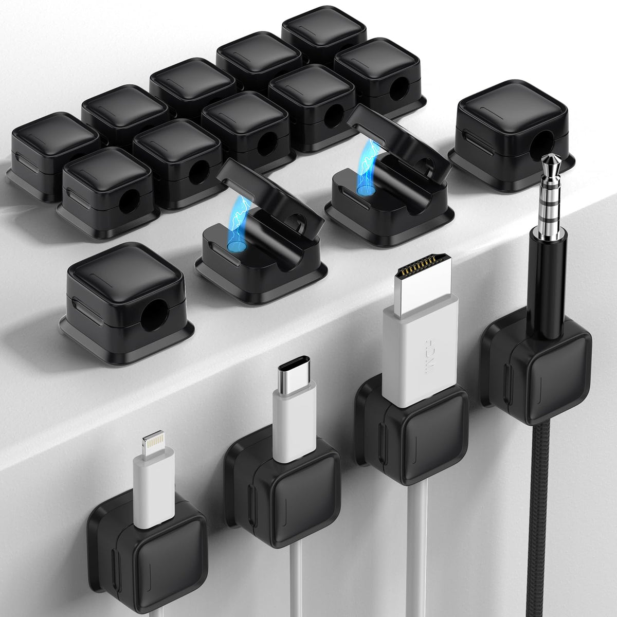 Costop cord organizer with adhesive mount keeps cables neatly aligned on a smooth surface.