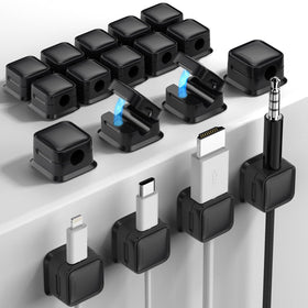 Costop cord organizer with adhesive mount keeps cables neatly aligned on a smooth surface.