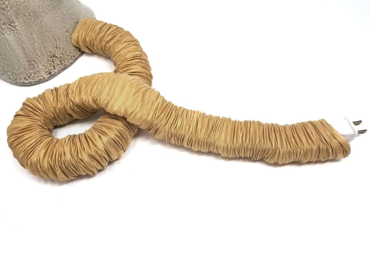 Close-up of gold faux silk fabric detail for COVEREase cord cover