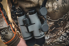 Covert Scouting Cameras CC0074 10x42 binoculars with accessories for transport and protection.