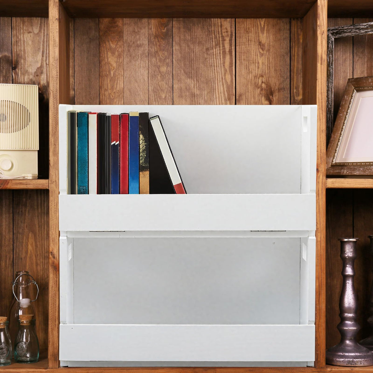 CroBlissful storage box placed on a desk to organize media.