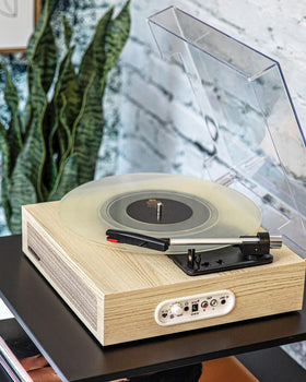 Crosley Scout turntable with built-in speakers shown from the side.