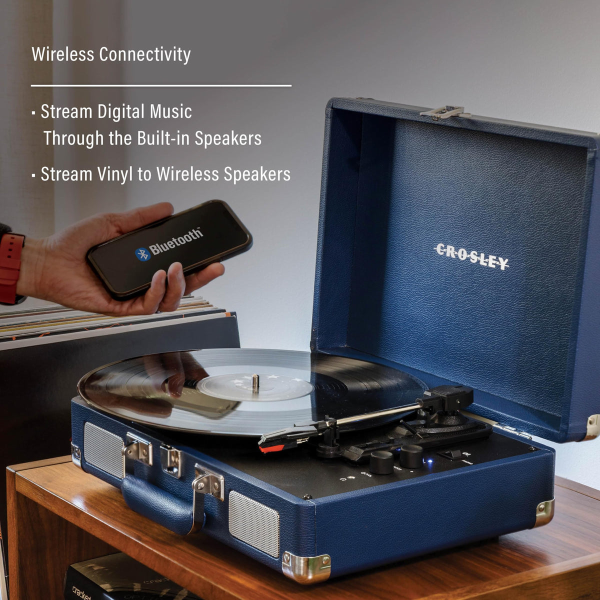 Side view of Crosley CR8005F-IB Cruiser Plus with RCA output and headphone jack for home listening.