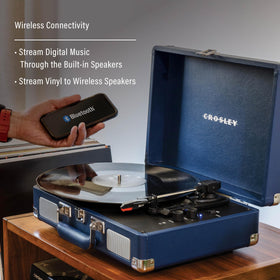 Side view of Crosley CR8005F-IB Cruiser Plus with RCA output and headphone jack for home listening.