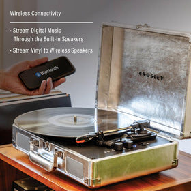 Open-lid view with records demonstrates built-in speakers for easy, all-in-one listening.