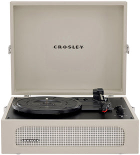 Crosley CR8017B-DU Voyager front view in Dune color highlighting the portable design.