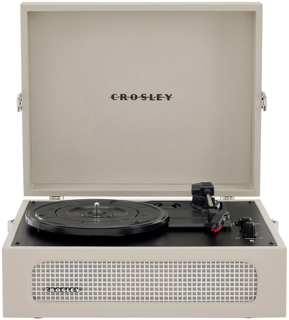 Crosley CR8017B-DU Voyager front view in Dune color highlighting the portable design.