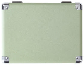 Crosley Cruiser next to a book for scale showing compact size and portability